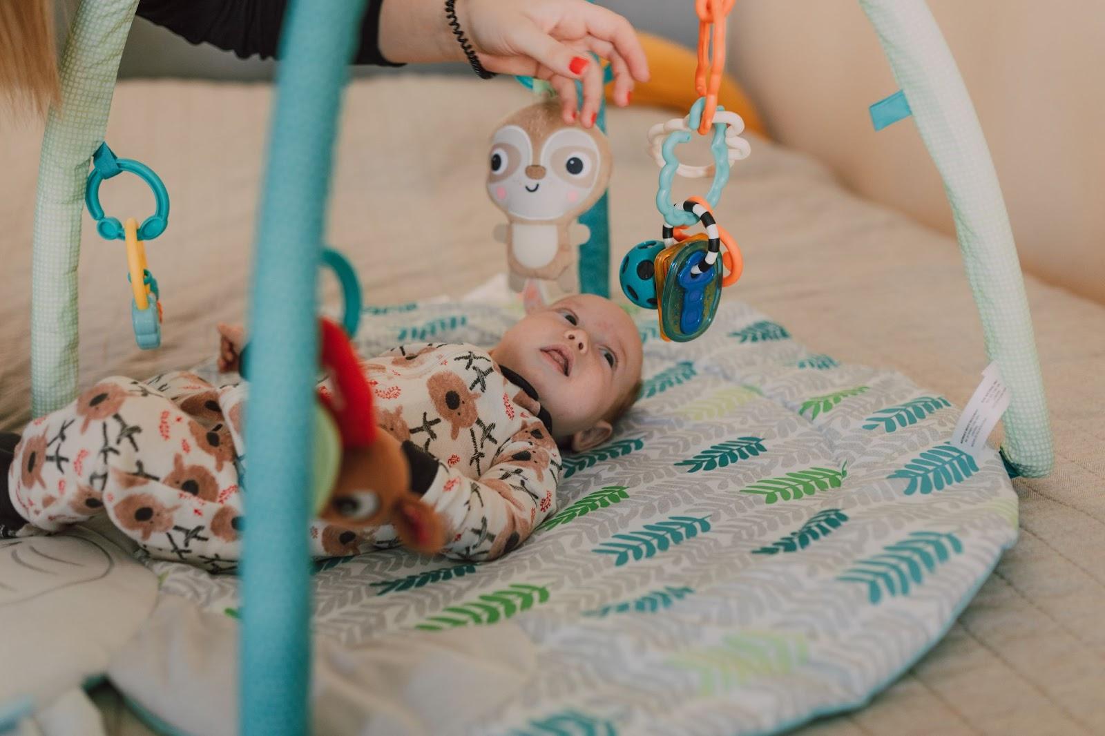 Baby on an activity gym mat