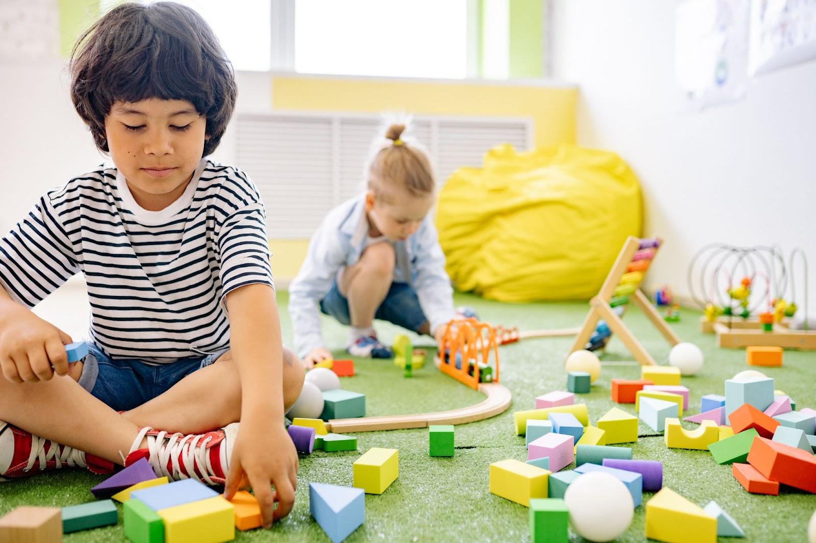 Kids building colourful shapes puzzles